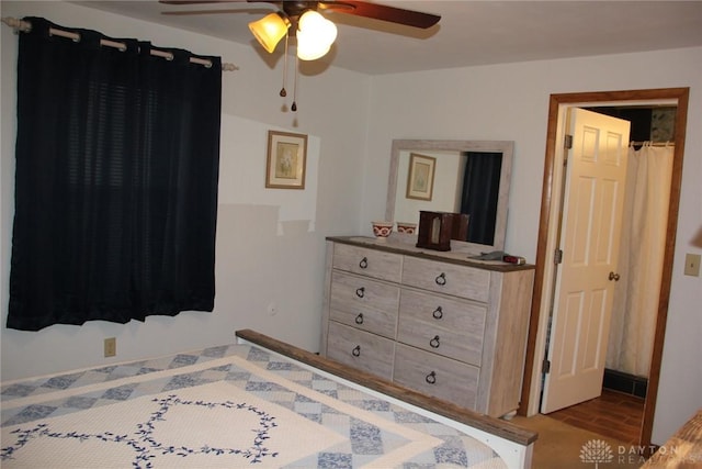 bedroom with a ceiling fan and wood finished floors