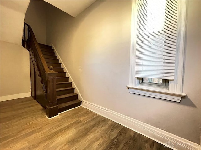 stairway featuring hardwood / wood-style flooring