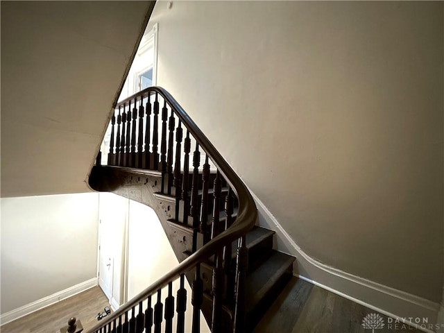 stairs with hardwood / wood-style floors