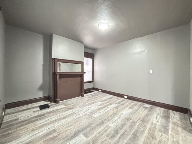 spare room featuring light hardwood / wood-style floors