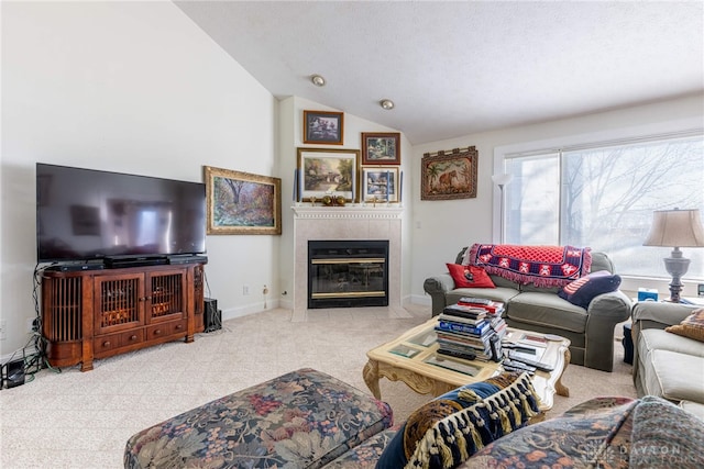 living room with a tile fireplace, a textured ceiling, and vaulted ceiling