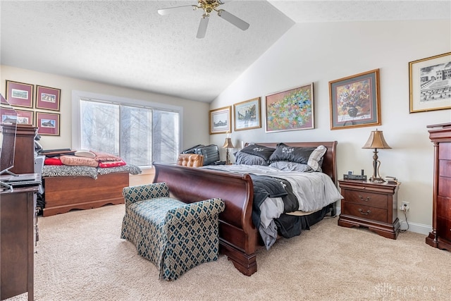 carpeted bedroom with a textured ceiling, ceiling fan, and lofted ceiling