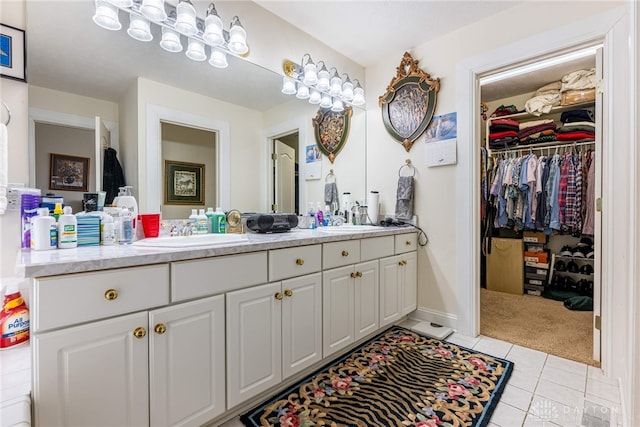 bathroom with tile patterned floors and vanity