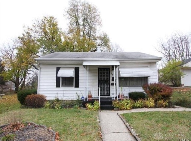 ranch-style house with a front lawn