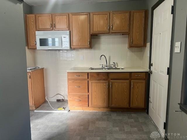 kitchen with sink and tasteful backsplash