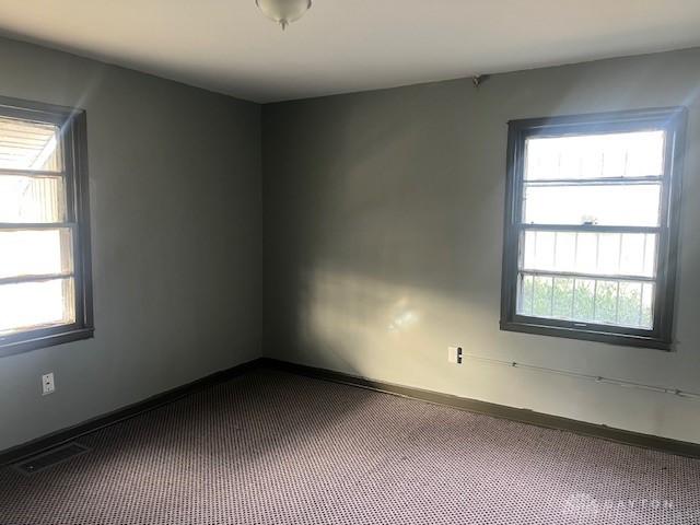 empty room featuring carpet flooring