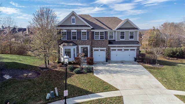 view of front of home with a garage and a front lawn