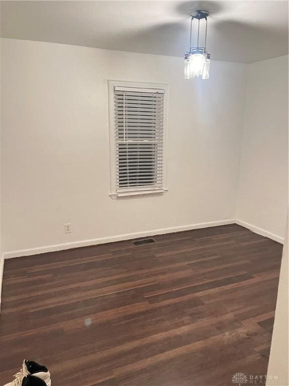 empty room featuring dark hardwood / wood-style floors