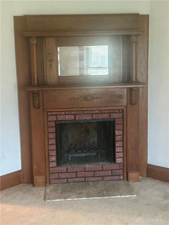 details featuring carpet floors and a brick fireplace