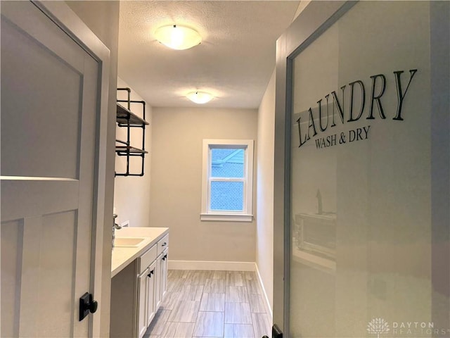 bathroom featuring vanity and a textured ceiling