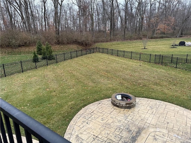 view of yard featuring a fire pit and a patio area