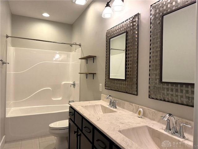 full bathroom with tile patterned floors, vanity, toilet, and shower / washtub combination