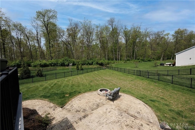 view of yard featuring a fire pit and a patio area