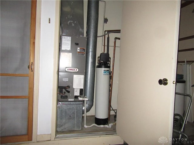 utility room with heating unit