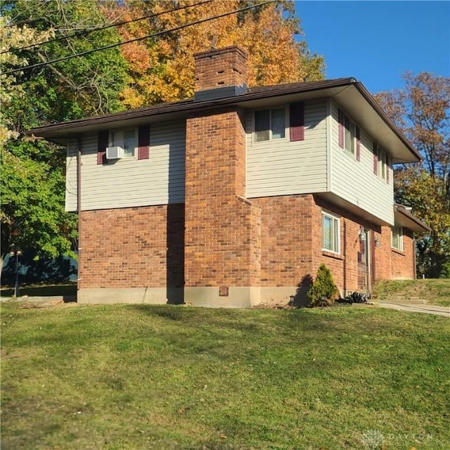 view of side of home featuring a yard