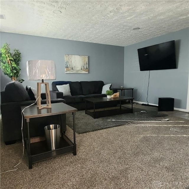 carpeted living room featuring a textured ceiling