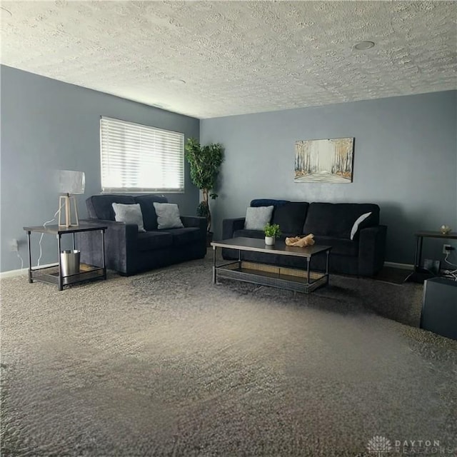 living room featuring carpet flooring and a textured ceiling