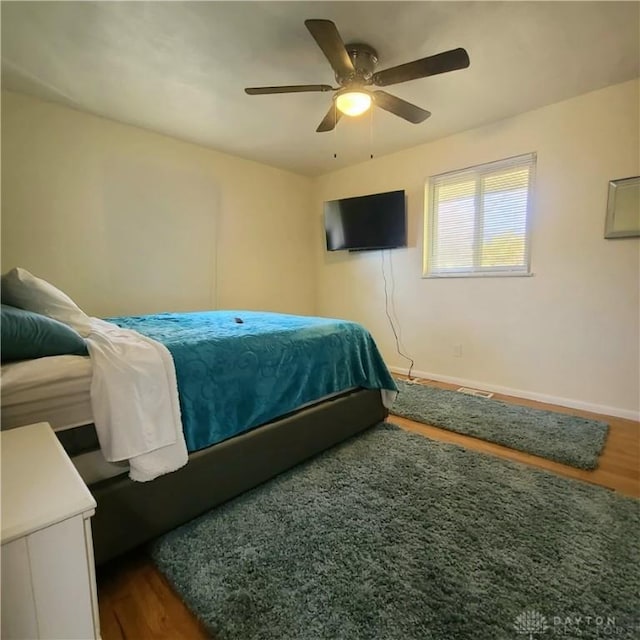 bedroom featuring wood-type flooring and ceiling fan