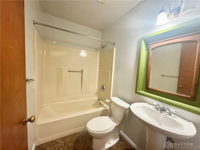 full bath with toilet, a sink, and washtub / shower combination