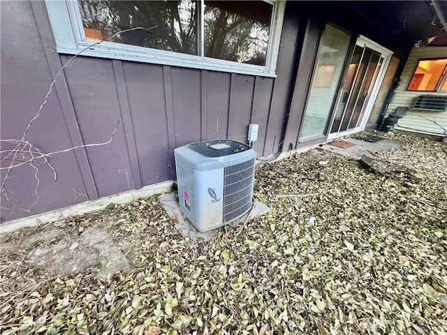 exterior details with central air condition unit and board and batten siding