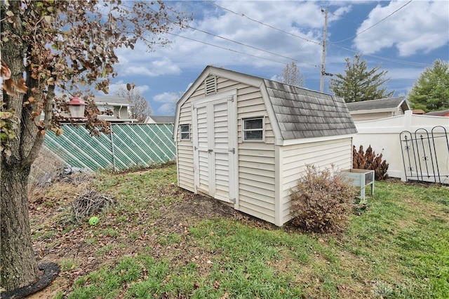 view of outdoor structure with a lawn