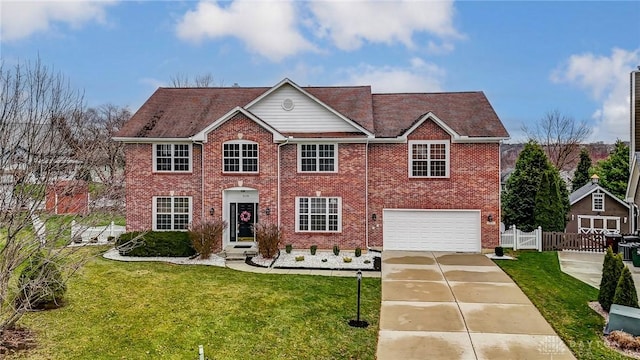 view of front facade with a front lawn and a garage