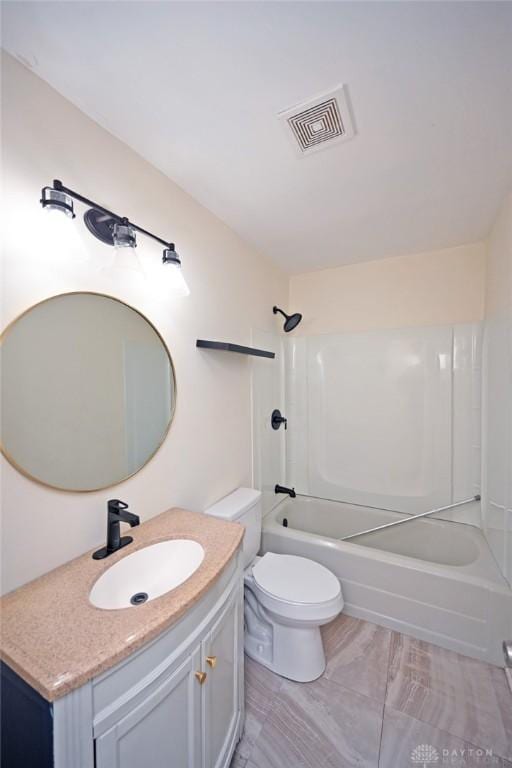 full bathroom featuring vanity, toilet, and shower / bath combination