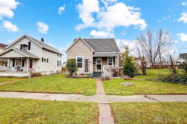 bungalow-style house featuring a porch and a front yard