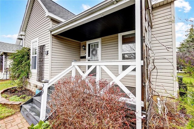 doorway to property with a porch