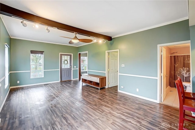 spare room featuring beam ceiling, dark hardwood / wood-style flooring, ceiling fan, and ornamental molding