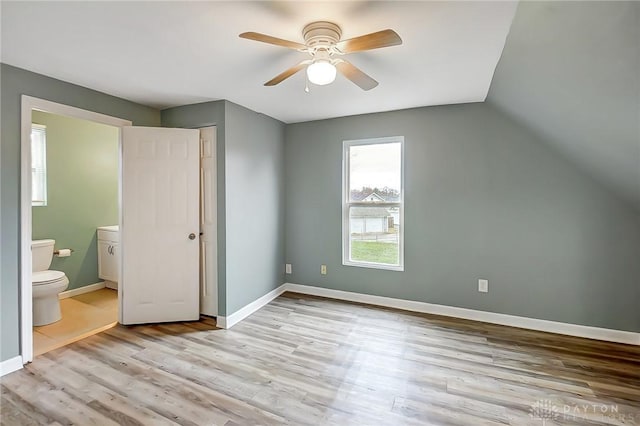 additional living space featuring ceiling fan, vaulted ceiling, and light hardwood / wood-style flooring