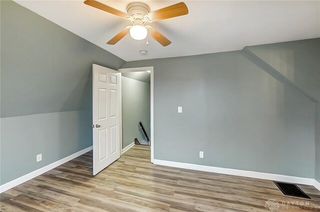 bonus room featuring ceiling fan, light hardwood / wood-style flooring, and lofted ceiling