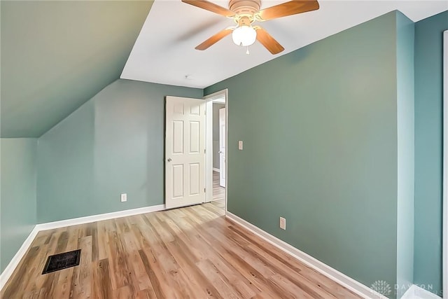 additional living space featuring vaulted ceiling, ceiling fan, and light hardwood / wood-style floors