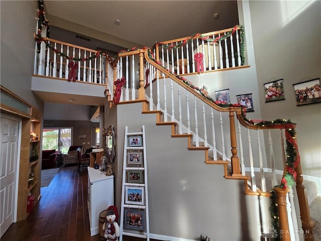 stairs featuring hardwood / wood-style flooring