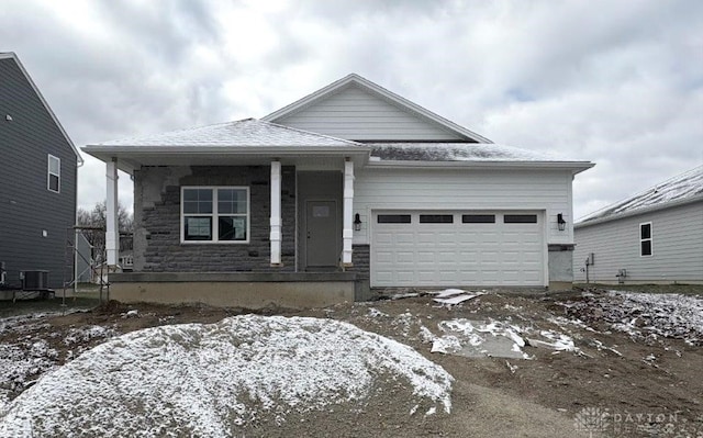 view of front of home with covered porch and a garage