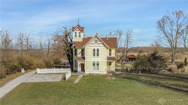 victorian-style house with a front yard