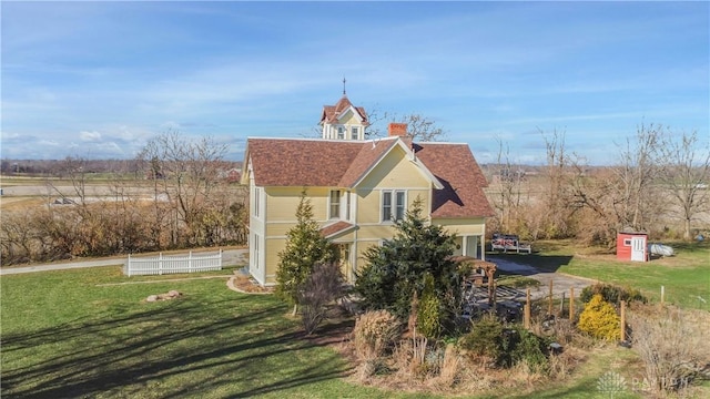 view of home's exterior with a yard