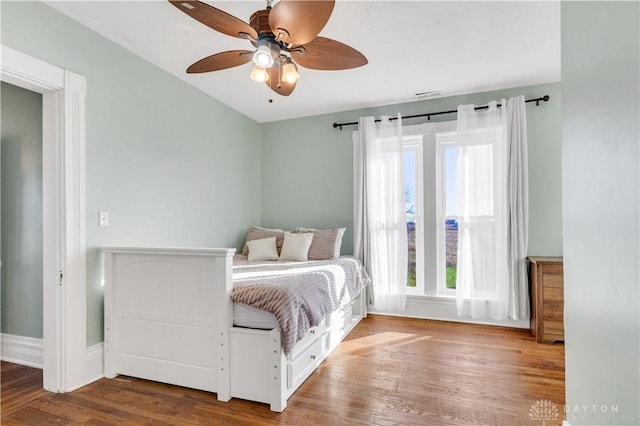 unfurnished bedroom with hardwood / wood-style flooring and ceiling fan