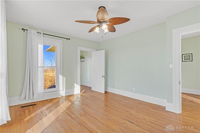 unfurnished bedroom featuring ceiling fan and light hardwood / wood-style flooring