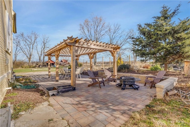 view of patio with a pergola and an outdoor fire pit