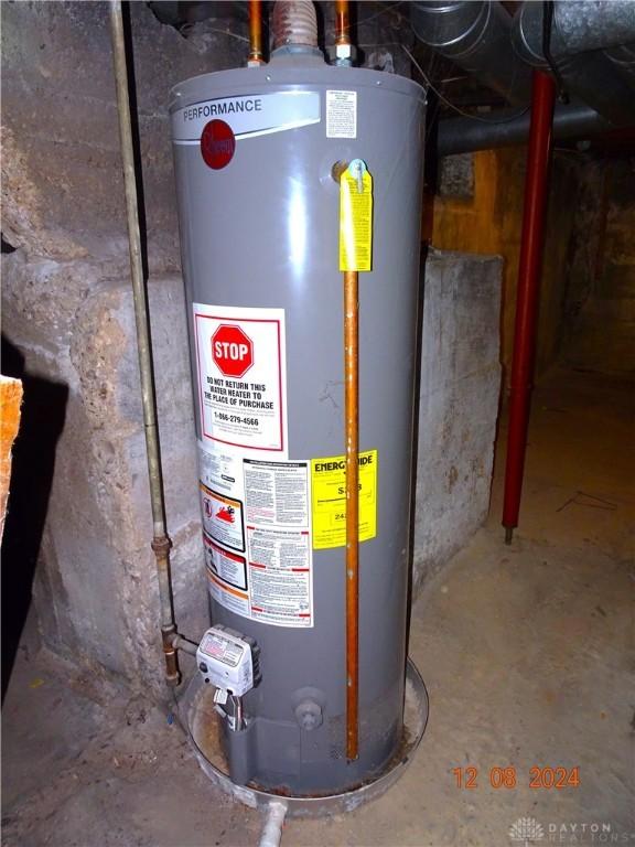 utility room featuring gas water heater