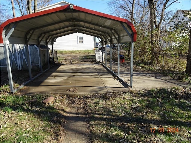 view of vehicle parking featuring a carport