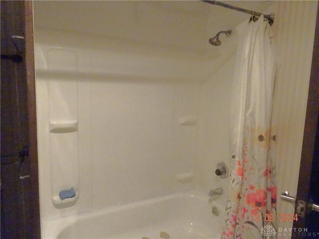 bathroom with shower / bath combination with curtain