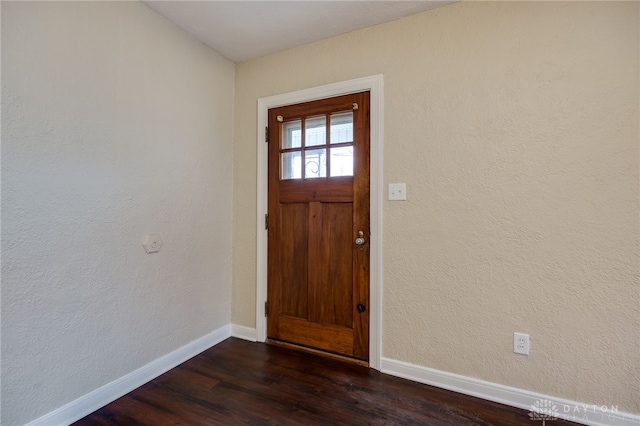 foyer entrance featuring dark hardwood / wood-style floors