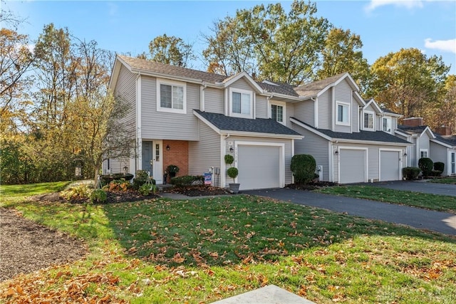 view of front of house with a front lawn and a garage