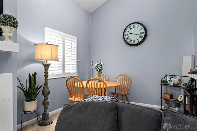 dining space with vaulted ceiling