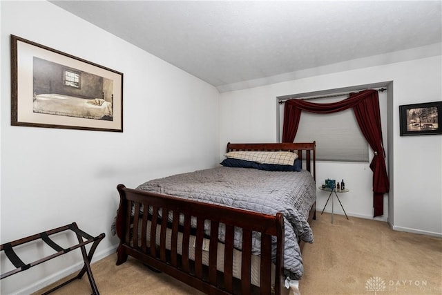 carpeted bedroom with baseboards
