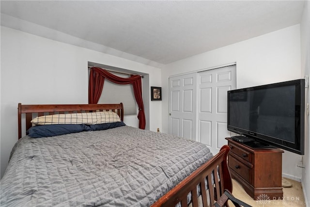 carpeted bedroom with a closet