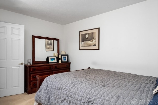 bedroom with light carpet