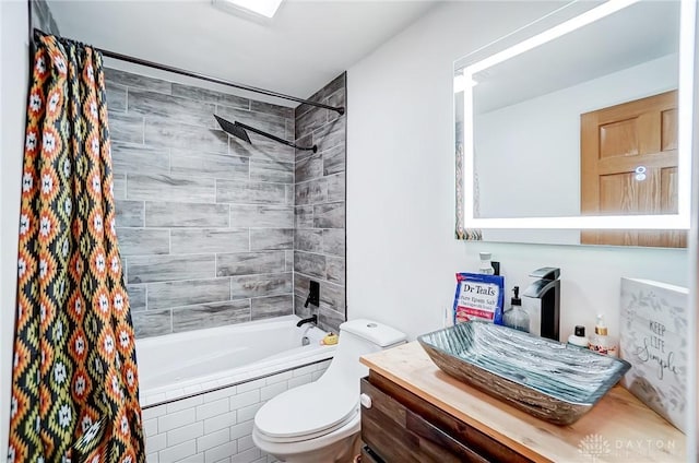 full bathroom featuring vanity, shower / bath combination with curtain, and toilet